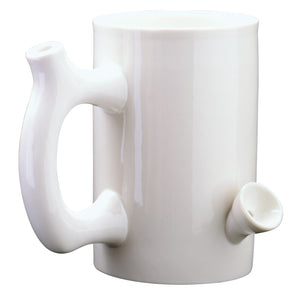 White Ceramic mug that is also a pipe. The mouth piece is on the handle and there is a bowl attached to the mug 